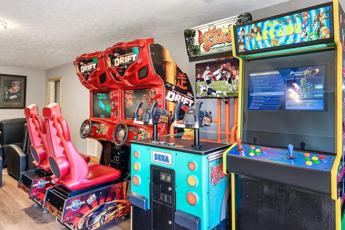 The photo features a vibrant lineup of arcade machines with colorful game graphics and themed décor, radiating an energetic ambiance perfect for nostalgia-filled battles and group fun.